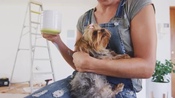 Portrait of a Caucasian woman in quarantine during coronavirus pandemic, drinking a tea alt