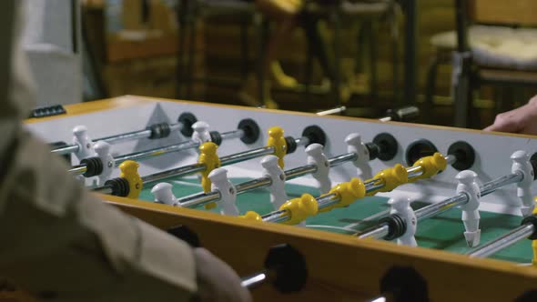 Man and woman playing tabletop football