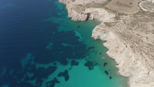 Wide Aerial Drone View Over Greek Island Mykonos in Summer with Turquoise Blue Aegean Sea alt