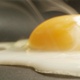 Closeup Of Cracked Egg Sizzling On A Frying Pan Shot On Red Camera - VideoHive Item for Sale