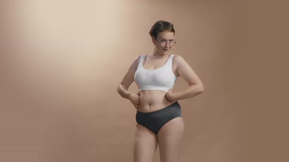 Full Figured Body Positive Caucasian Woman in Underwear Appreciate and Being Proud of Her Forms