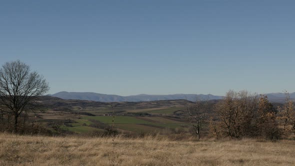 Landscape in Eastern Serbia slow tilt 4K 2160p 30fps UltraHD footage - Tilting on hills by the day 3 alt