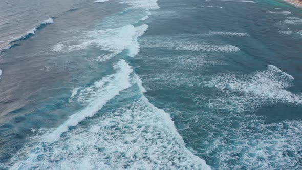 Calm Waves Roll and Cover Boundless Blue Ocean Surface alt