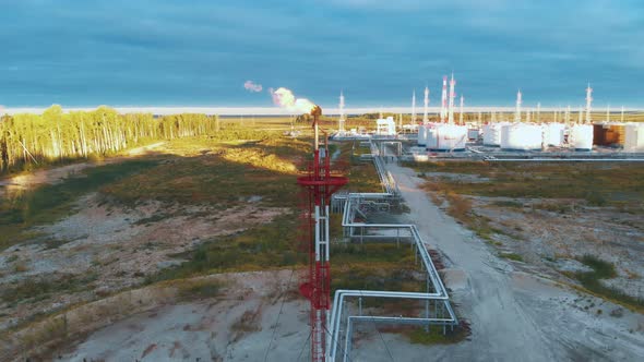 A Drone Flies Around a Burning Torch at an Oil Field in Siberia alt