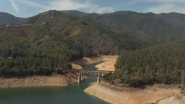 Aerial view of Shasta Lake in Northern California low water levels during drought alt