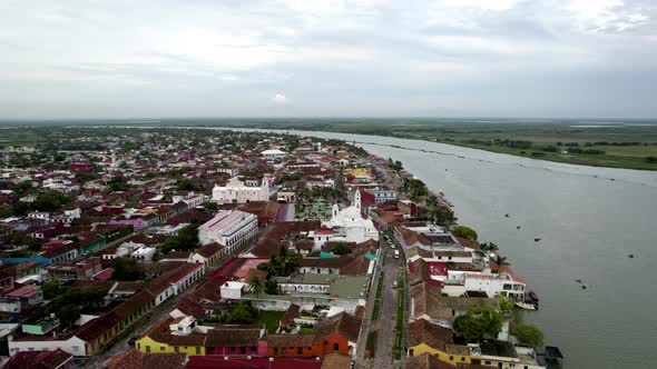 rotational drone shot of the main square and the papaloapan river in tlacotalpan, veracruz, mexico alt