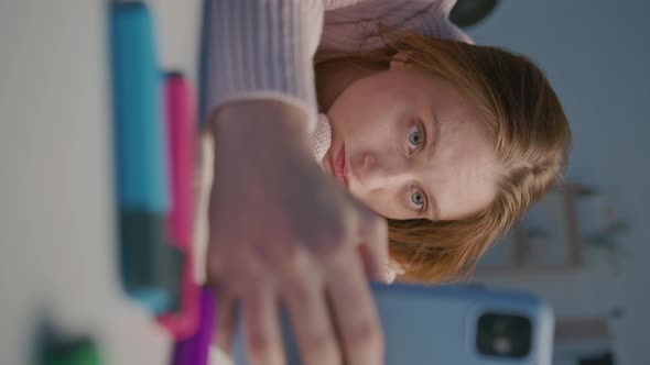 Tired Female Designer Using Mobile Phone