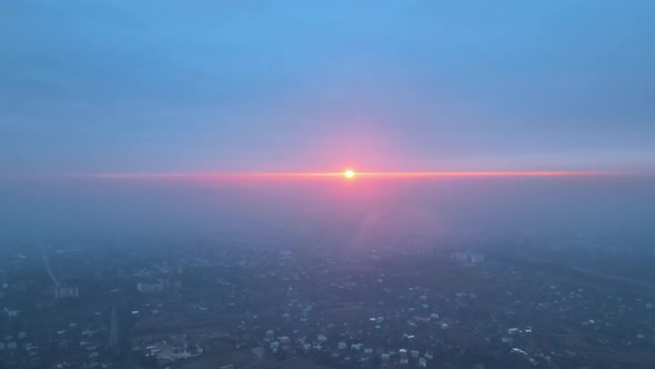 Aerial View From Airplane Window at High Altitude of Earth Covered with White Thin Layer of Misty alt