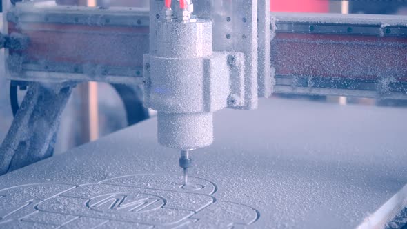 Milling Machine Carves the Form on a White Surface Closeup alt