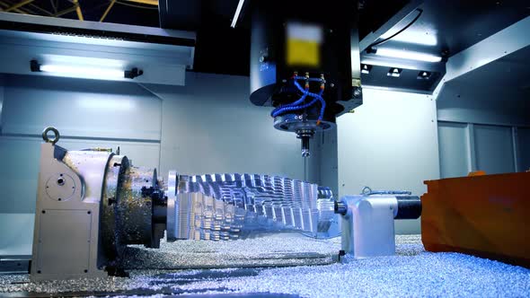 Cnc Milling Machine. Processing and Cutting of Parts from a Piece of Metal in the Industrial Area