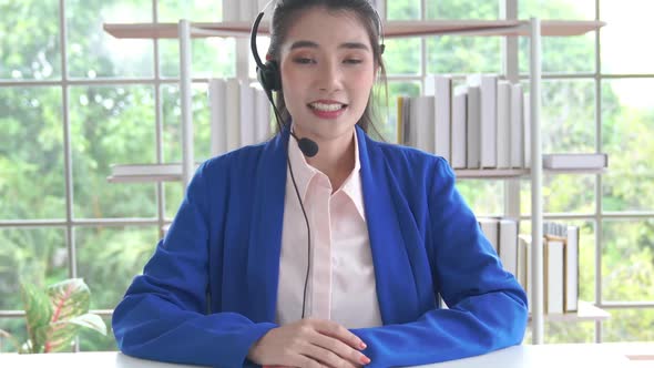 Video Call Camera View of Businesswoman Talks Actively in Videoconference alt