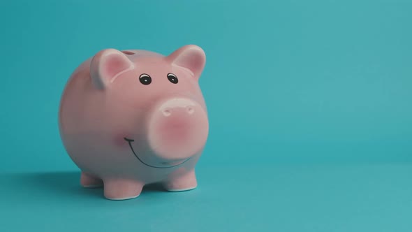 Saving Up Euro Coins In a Piggy Bank