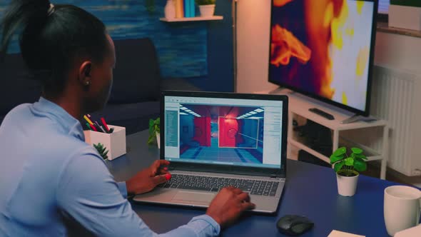 Young African Woman Gamer Testing Online Professional Game on Laptop alt