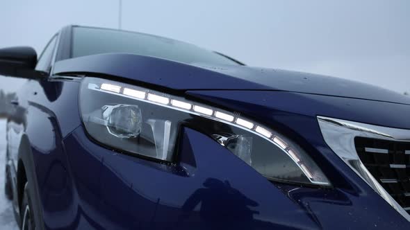 LED headlights and running lights in a blue SUV. close-up