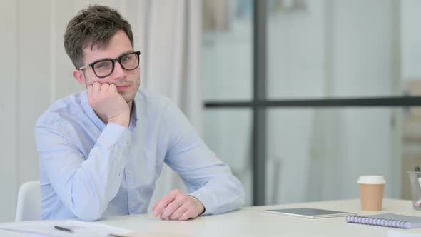 Young Man Thinking Feeling Worried alt