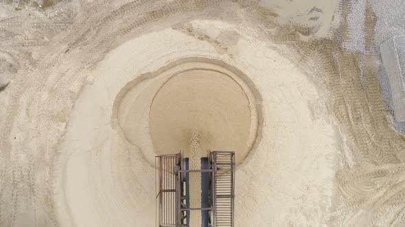 Aerial view of sand heaps alt