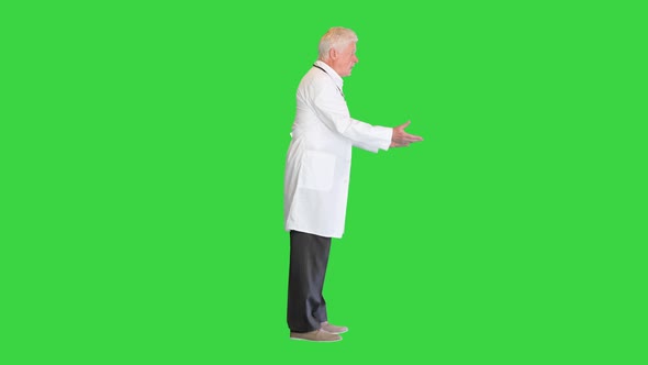 Elderly Male Doctor Arguing with Someone on a Green Screen Chroma Key alt