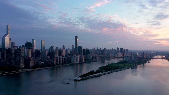 Roosevelt Island and midtown manhattan aerial view at sunrise alt