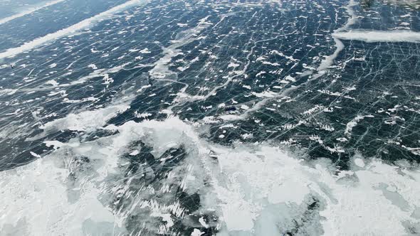 Hovercraft Gliding on Beautiful Frozen Ice Surface of Baikal Lake in Winter in Russia alt