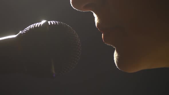 Woman screaming to a microphone