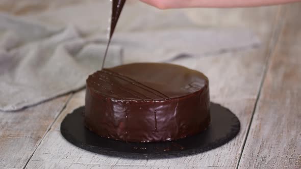 Chef Decorate the Cake with Melted Chocolate