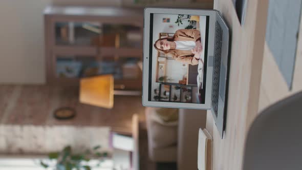 Vertical Shot of Laptop with Online Class Video alt