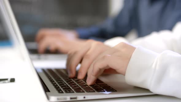 Male Hands Typing On Laptops alt
