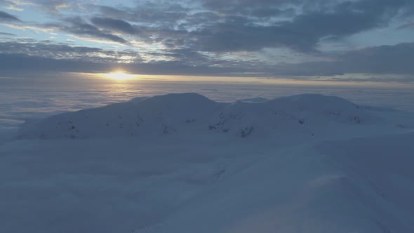 Sun Over Snowy Mountains