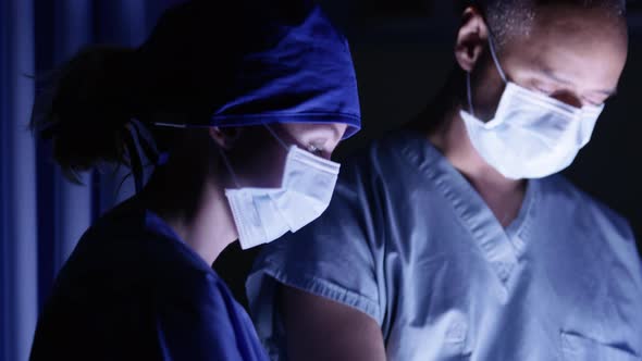 Closeup of surgeons in operating room