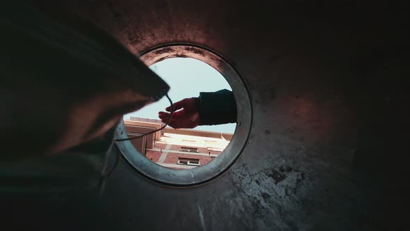 FAce Mask Being Dropped Inside Bin From Low Angle alt