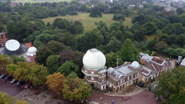 A Drone View of an Observatory with White Domes and a Green Park Nearby