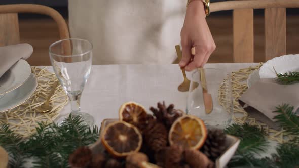 Close up of women preparing table for Christmas Eve. Shot with RED helium camera in 8K alt