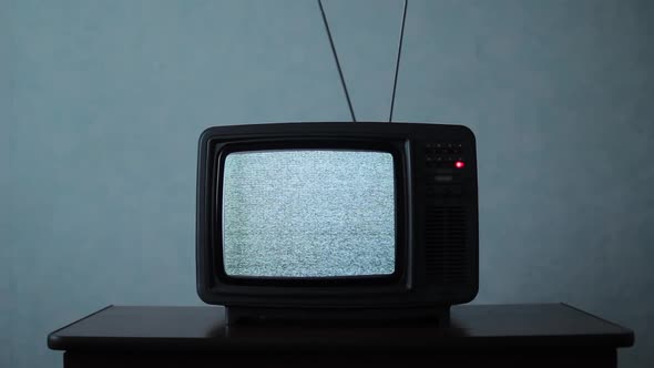 Retro TV with White Noise in a Dark Room