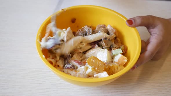 Eating Fresh Vegetable Salad Bowl on Cafe Table alt