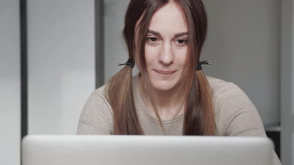 Cute 20s Lady Working at Desk in Trendy Hipster Start Up Office Using Shared Data alt