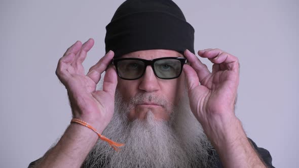 Face of Happy Mature Bearded Hipster Man Smiling and Laughing alt