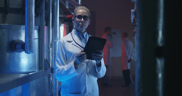 Female Scientist Looking at Camera alt