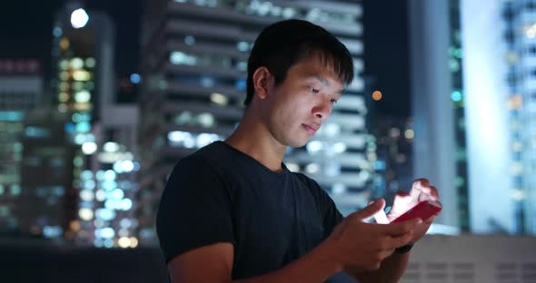 Man Use of Mobile Phone in The Street at Night alt