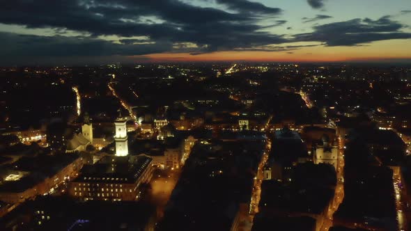 Flight Above the Roofs on Sunrise. Old European City. Ukraine Lviv City alt