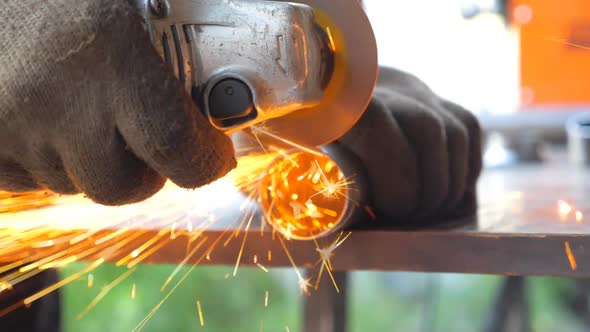 Detail View on Metal Processing with Circular Saw alt