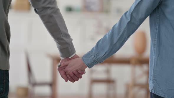 Close Up of Couple Holding Hands alt
