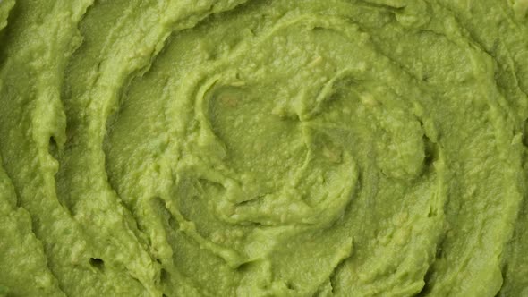 Fresh avocado puree top view, rotate alt