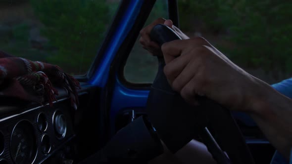Young man on a road trip in pick-up truck alt