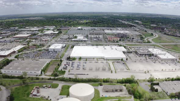 Aerial Drone View of Warehouse Area Near American Suburb alt