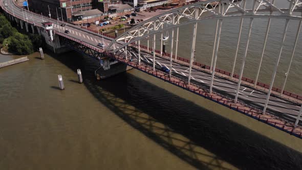 Traffic Over Arched Bridge In Noord River, Alblasserdam, South Holland, Netherlands. - Aerial Drone alt
