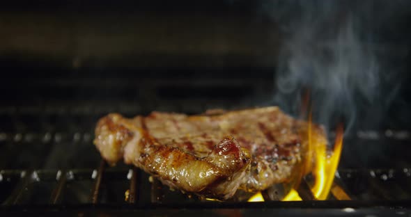 T-Bone Beef Steak On A Grill With Flames 40b