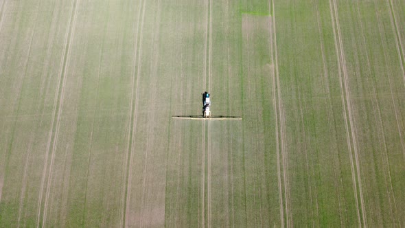 Processing of Agricultural Fields with Fertilizers and Pesticides From Weeds and Pests