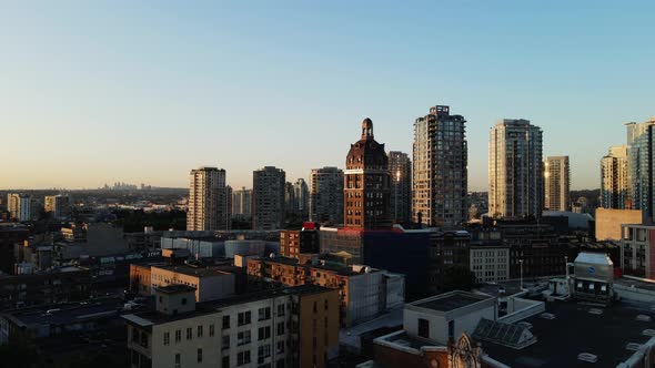 aerial drone footage of downtown Vancouver buildings, gastown, early sunrise, morning urban scrapers alt