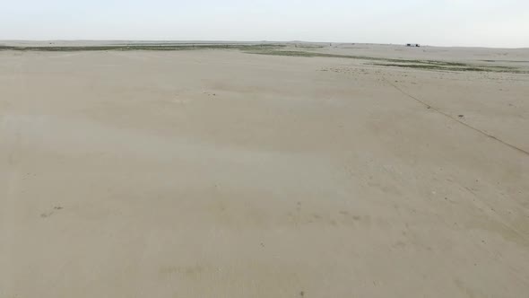  Flying over Dunes over  farming in the Desert   and showing Irrigation System for farming  alt