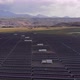 Aerial Shot of a Huge Solar Power Plant in a Big Field. Electricity Generation From Solar Energy